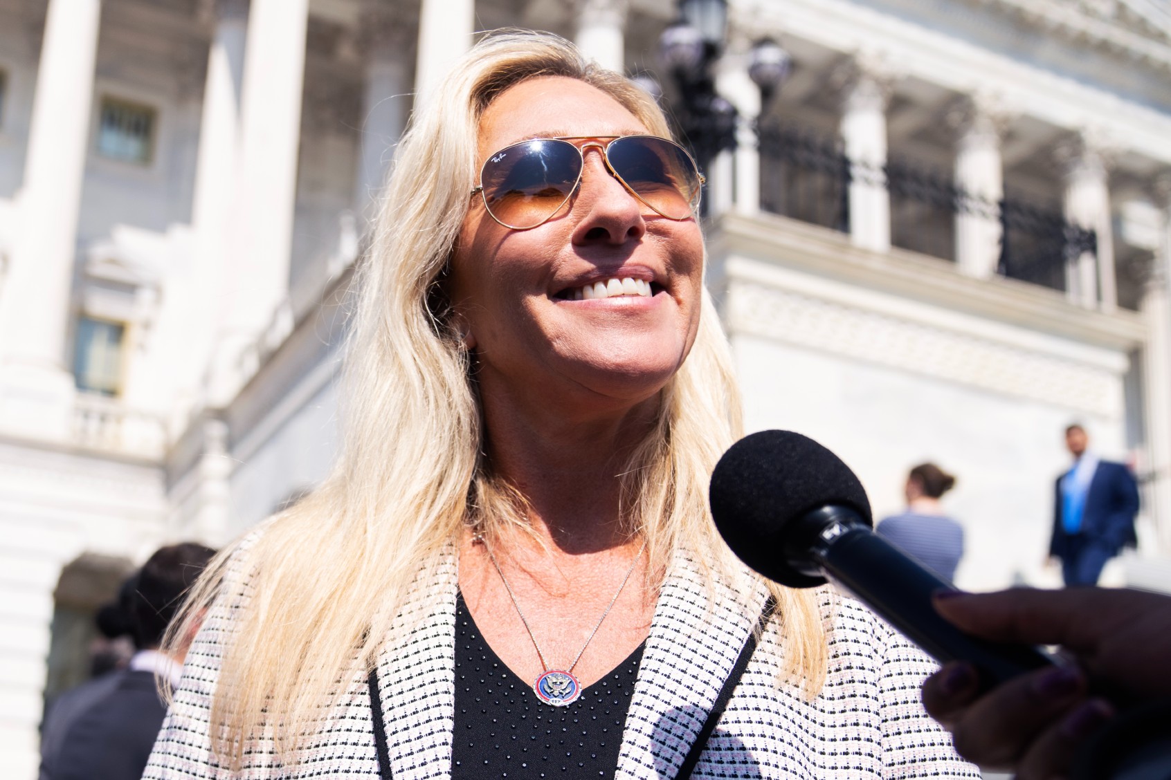 Rep. Marjorie Taylor Greene, R-Ga., talks with reporters outside the U.S. Capitol after the last votes of the week on Thursday, May 25, 2023. (Tom Williams/CQ-Roll Call, Inc via Getty Images)