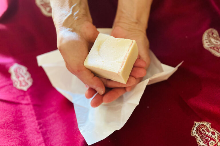 The author's mother holding a bar of Saboun Nabulsi. (Photo courtesy of the author)