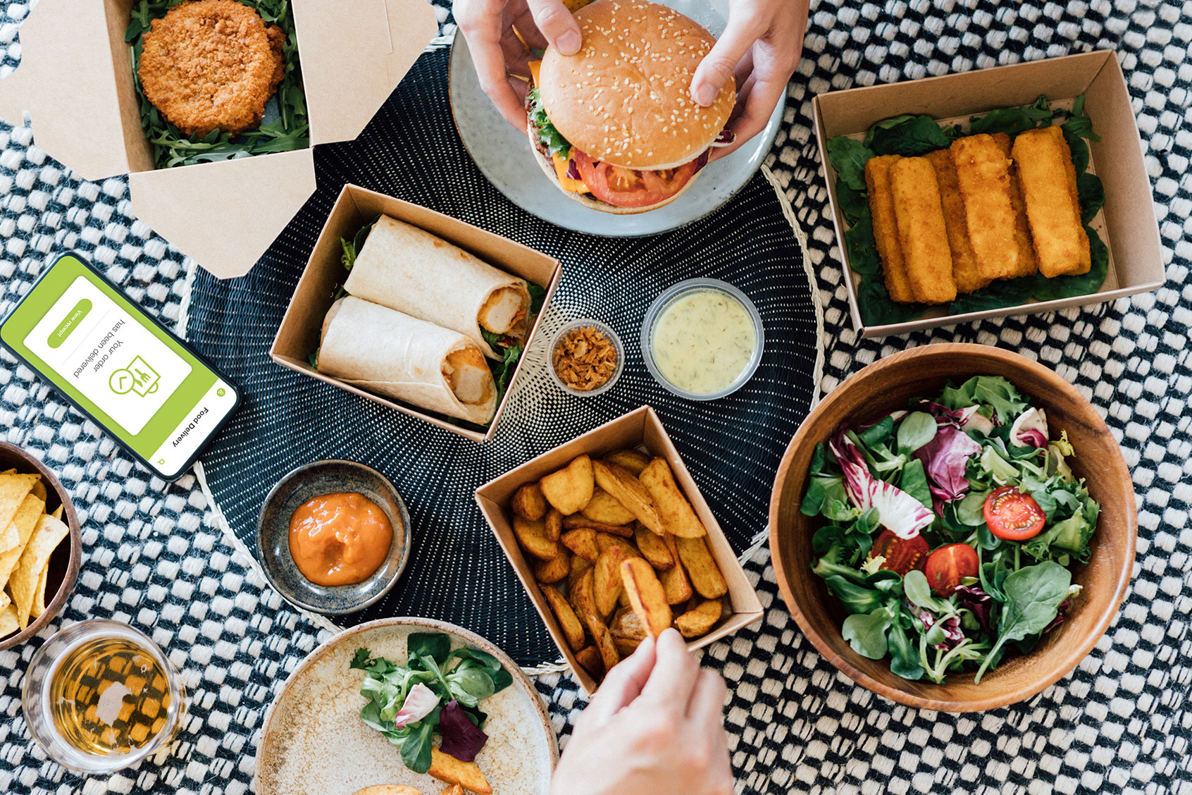 Flat lay view of couple eating delicious takeaway fast food meal (Getty Images/Oscar Wong)