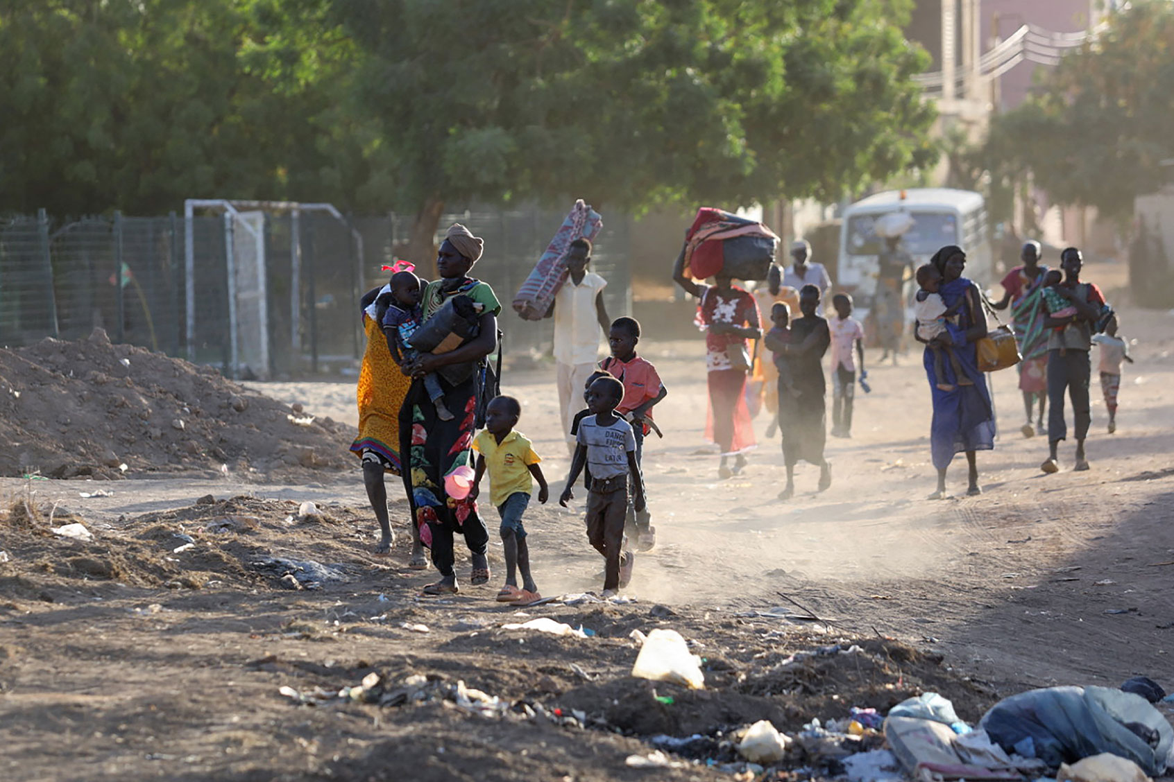 People flee their neighbourhoods amid fighting between the army and paramilitaries in Khartoum on April 19, 2023, following the collapse of a 24-hour truce. (AFP via Getty Images)
