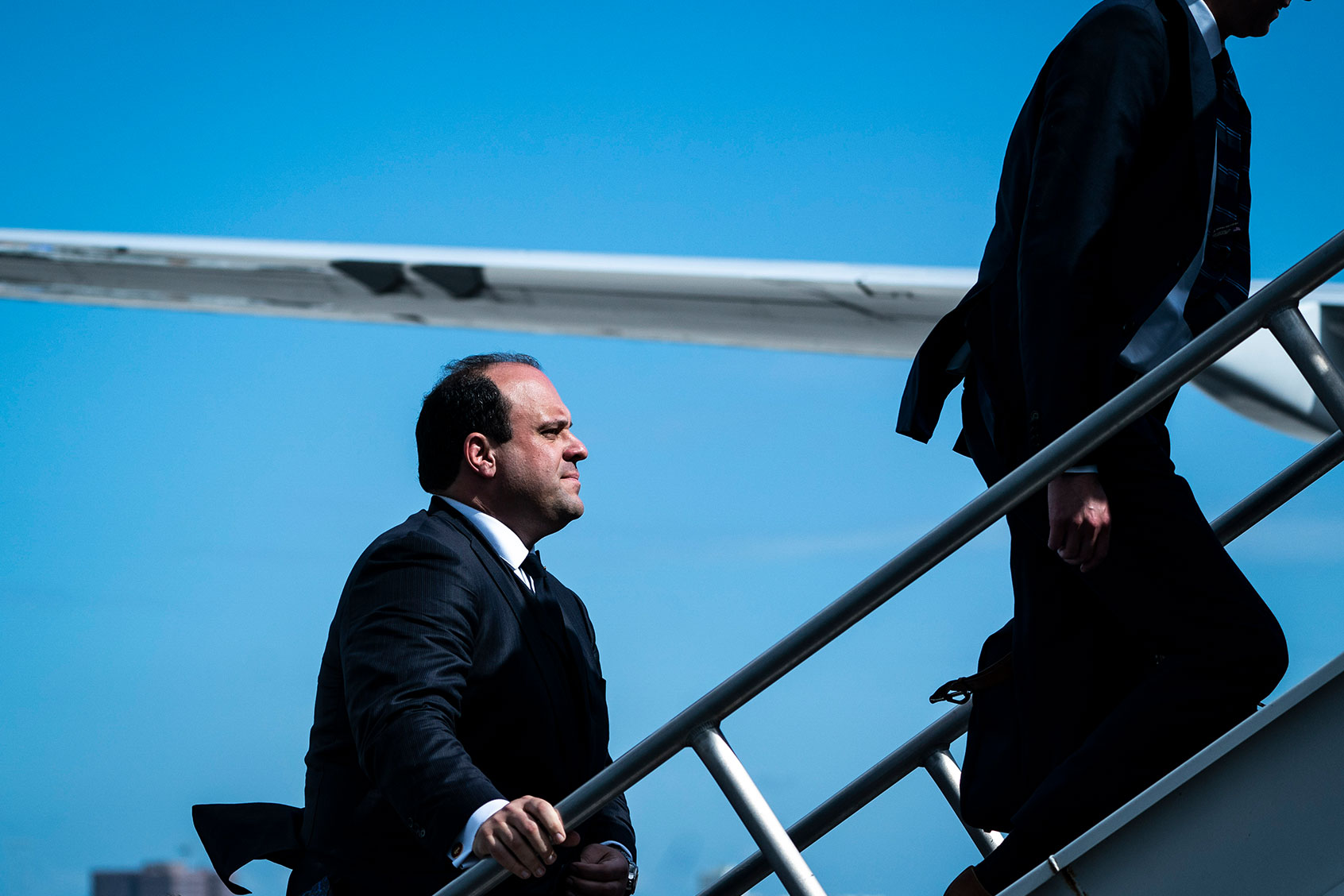Boris Epshteyn follows former President Donald Trump as they board his airplane, known as "Trump Force One," to fly back to NJ minutes after Trump pleaded not guilty to federal charges, on Tuesday, June 13, 2023, in Miami, FL. (Jabin Botsford/The Washington Post via Getty Images)
