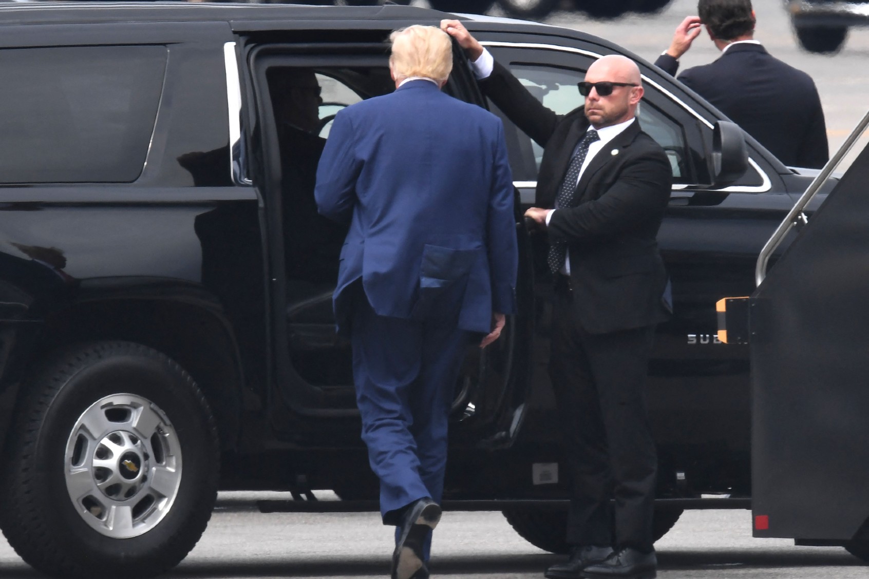 Former U.S. President and 2024 hopeful Donald Trump disembarks his plane "Trump Force One" on arrival at Ronald Reagan Washington National Airport in Arlington, Virginia, on August 3, 2023. (OLIVIER DOULIERY/AFP via Getty Images)