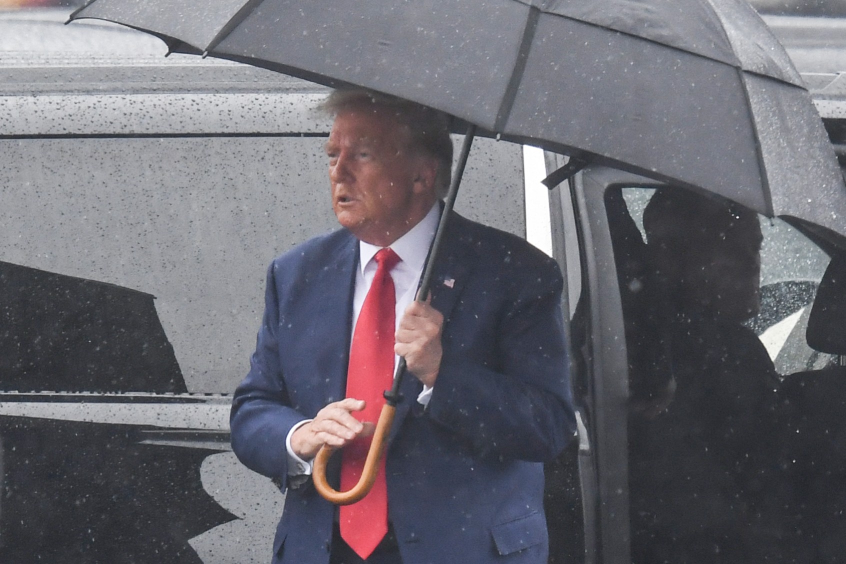 Former U.S. President and 2024 hopeful Donald Trump arrives to Ronald Reagan Washington National Airport in Arlington, Virginia, on August 3, 2023, after his arraignment in court. (OLIVIER DOULIERY/AFP via Getty Images)