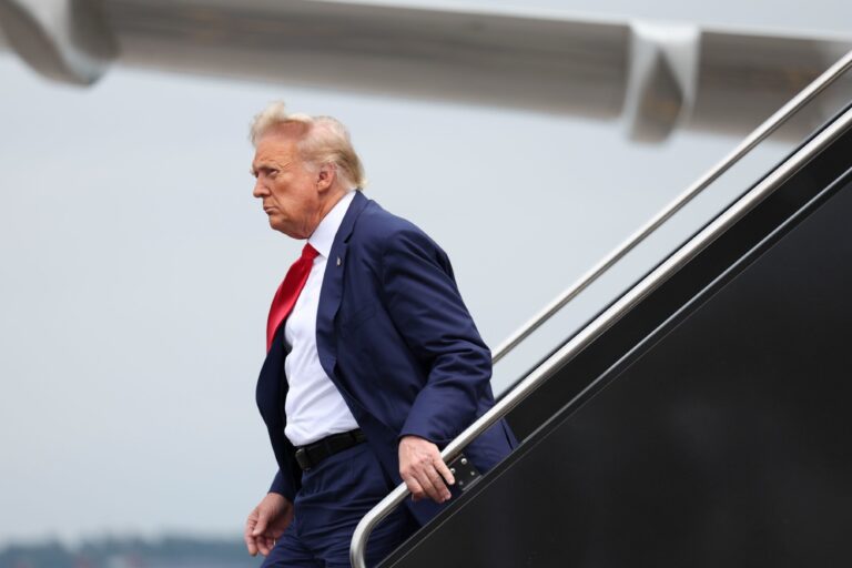 Former president Donald Trump arrives at Ronald Reagan Washington National Airport in Arlington, Va. on Thursday, August 3, 2023. (Tom Brenner for The Washington Post via Getty Images)