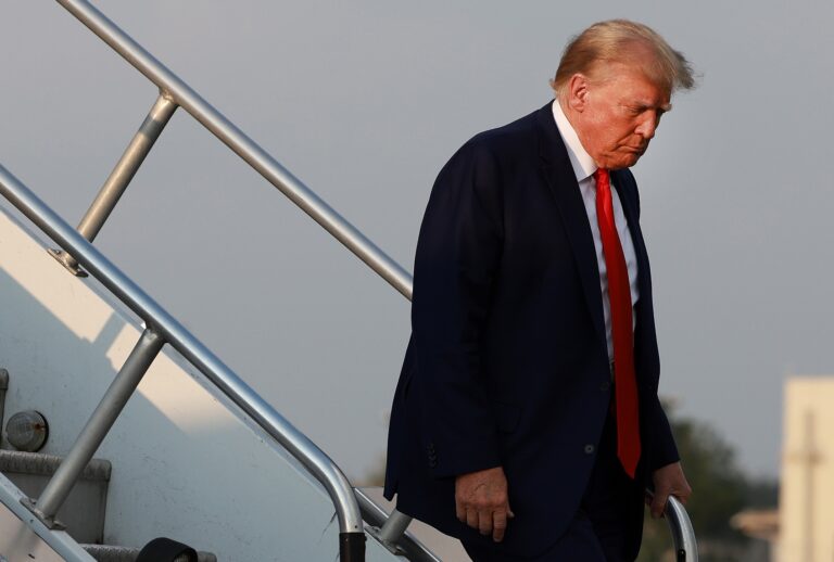 Former U.S. President Donald Trump arrives at Atlanta Hartsfield-Jackson International Airport to surrender at Fulton County Jail on August 24, 2023 in Atlanta, Georgia. (Joe Raedle/Getty Images)