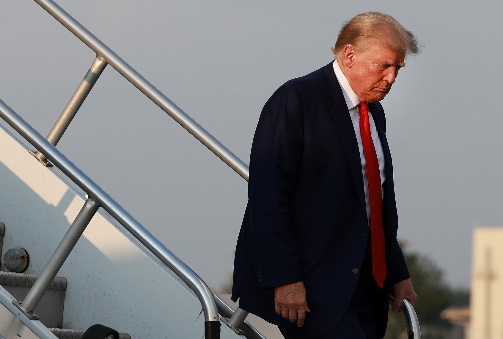Former U.S. President Donald Trump arrives at Atlanta Hartsfield-Jackson International Airport to surrender at Fulton County Jail on August 24, 2023 in Atlanta, Georgia. (Joe Raedle/Getty Images)