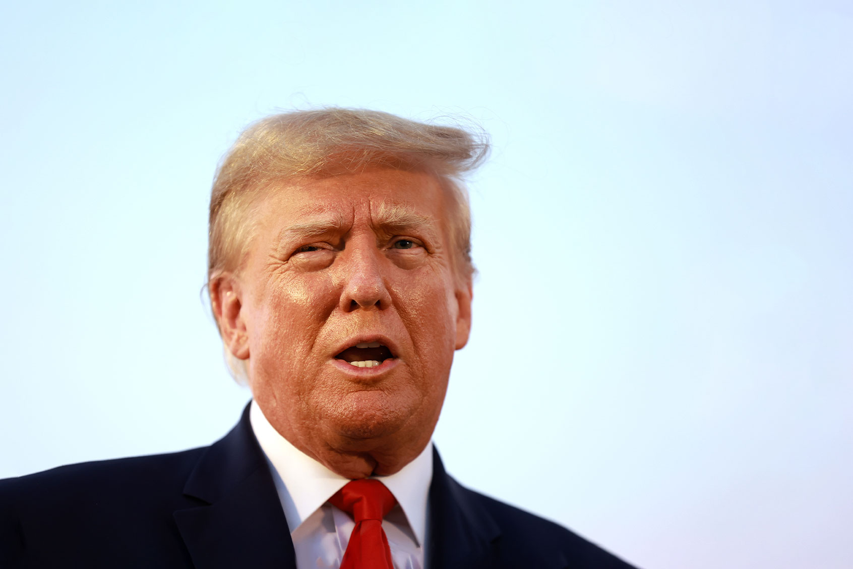 Former U.S. President Donald Trump speaks to the media at Atlanta Hartsfield-Jackson International Airport after being booked at the Fulton County jail on August 24, 2023 in Atlanta, Georgia. (Joe Raedle/Getty Images)