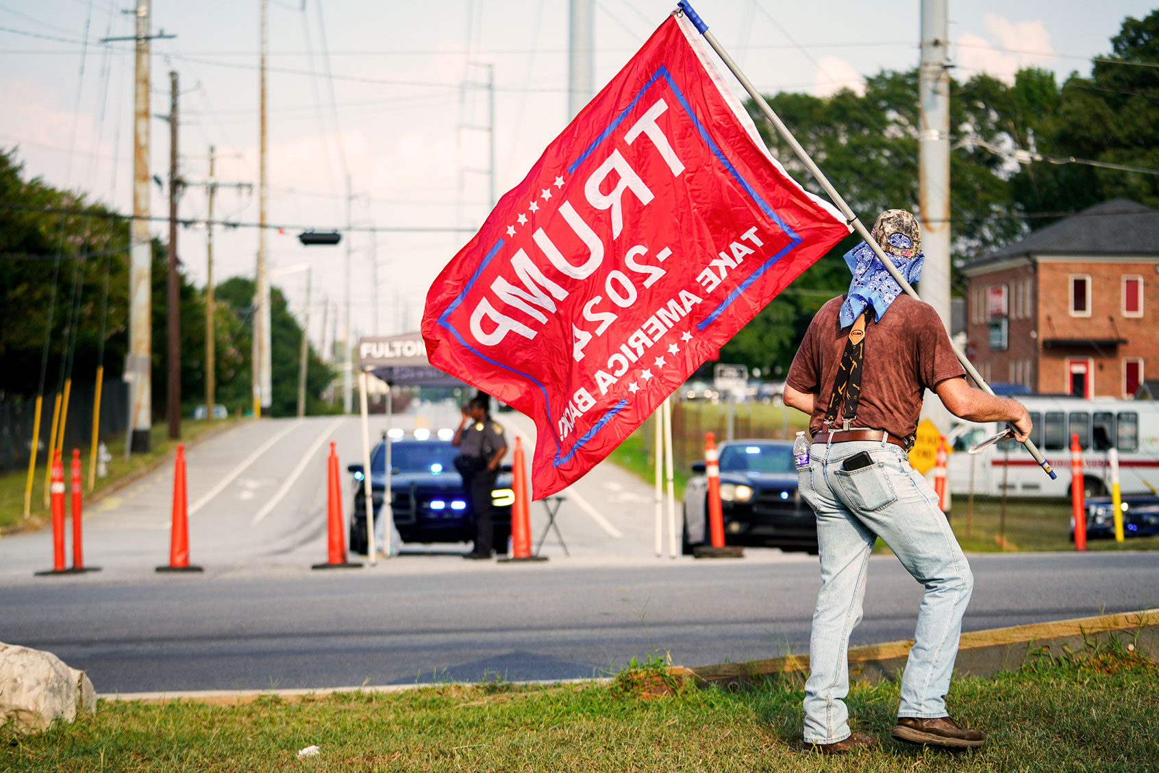 A Trump supporter walks up Marietta boulevard ahead of the former presidents arrive in Atlanta, Georgia, United States on August 24, 2023. (Benjamin Hendren/Anadolu Agency via Getty Images)