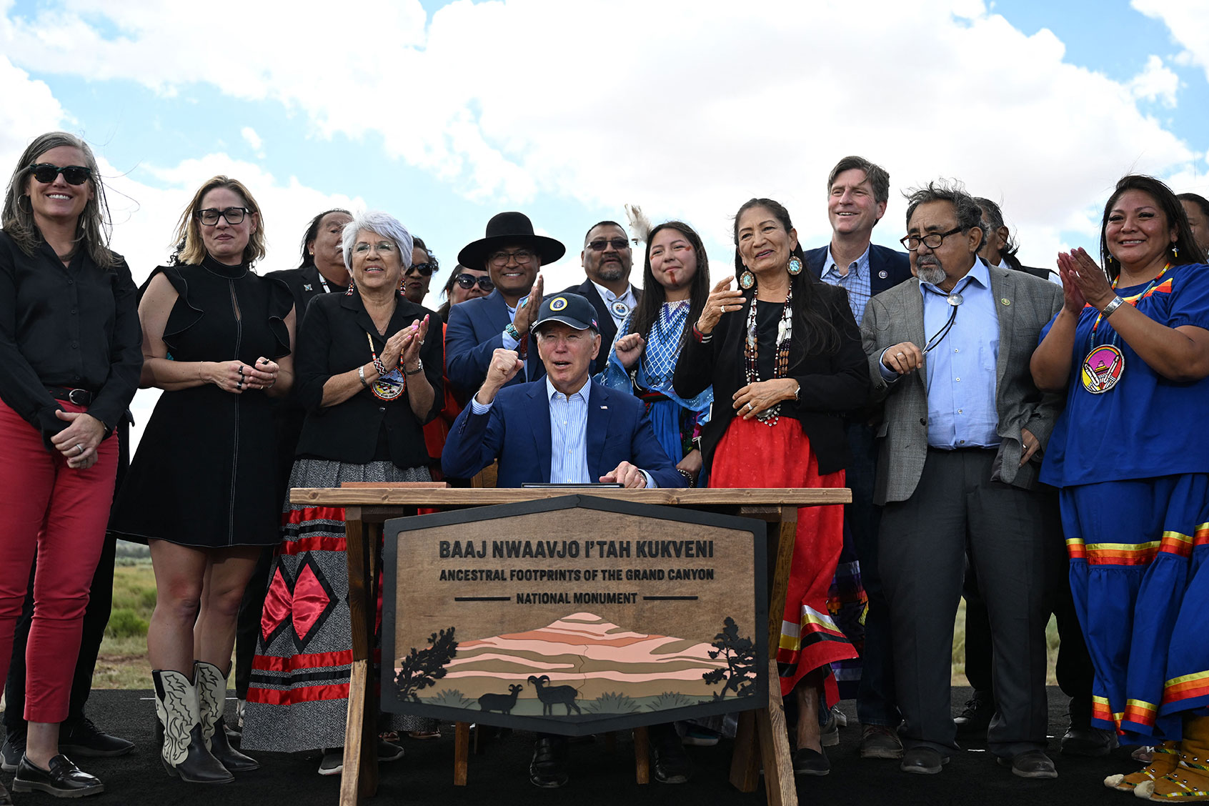 US President Joe Biden (C) gestures after signing a proclamation to designate Baaj Nwaavjo I'tah Kukveni Ancestral Footprints of the Grand Canyon National Monument, at Red Butte Airfield, 25 miles (40kms) south of Tusayan, Arizona, on August 8, 2023. (JIM WATSON/AFP via Getty Images)