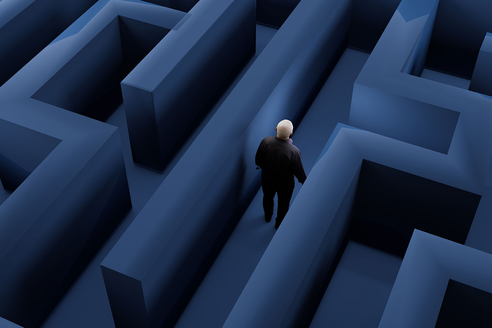 Male figure walking through maze (Getty Images/OsakaWayne Studios)