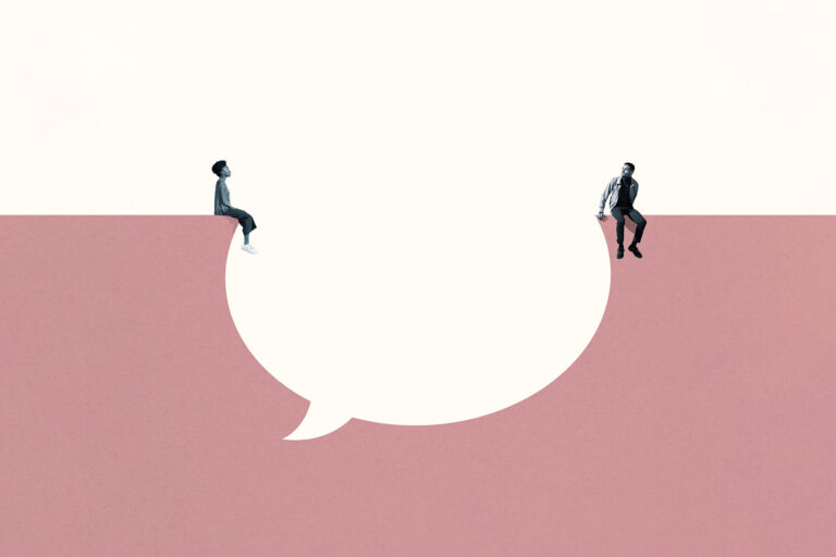 A man and woman sitting across a speech bubble (Getty Images/Klaus Vedfelt)