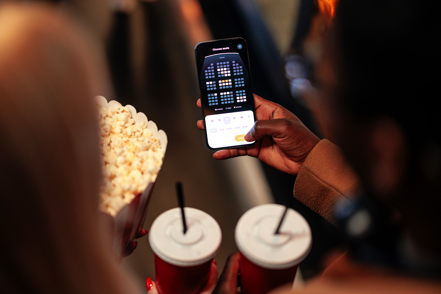 Woman at a movie theater (Getty Images / bernardbodo)