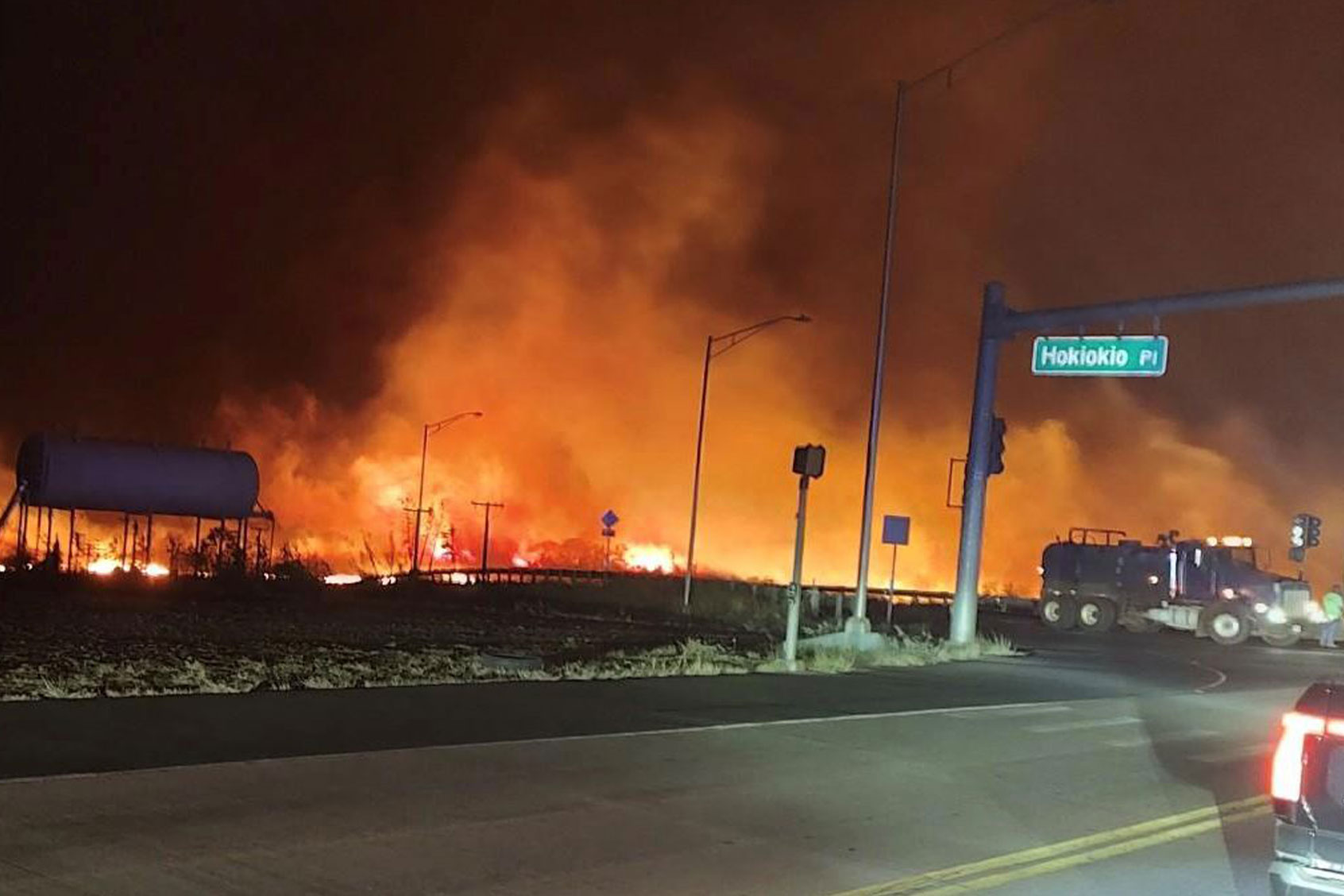 In this image obtained from the County of Maui, a wildfire burns on the island of Maui near an intersection at Hokiokio Place and Lahaina Bypass in Lahaina, Hawaii, August 9, 2023. (Photo courtesy of County of Maui / Zeke Kalua)