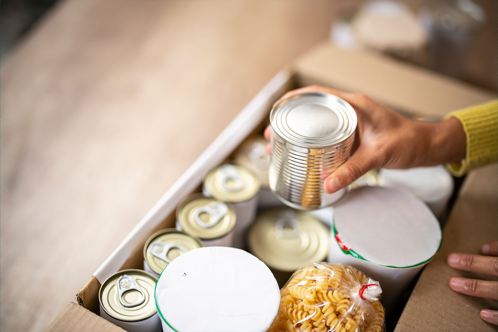 Working at charitable foundation, packing donation box (Getty Images/Witthaya Prasongsin)