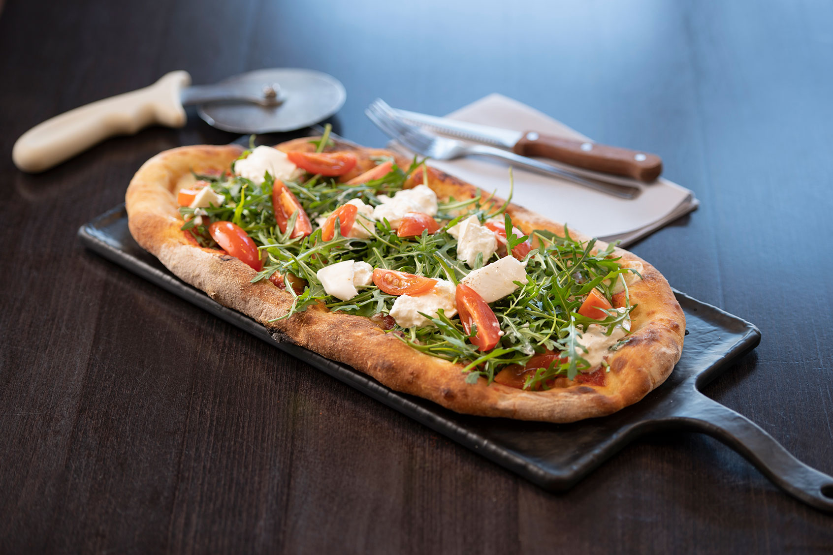 Cheese, tomato and rocket Pinsa Romana, a Roman style pizza (Getty Images/Monty Rakusen)