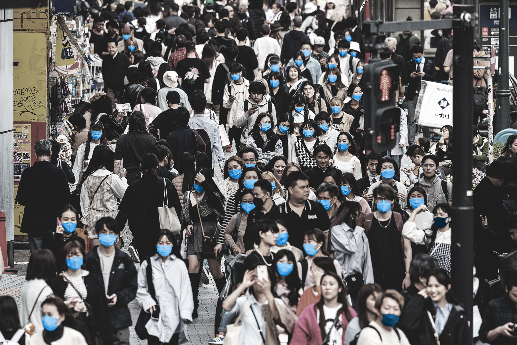 Crowds of people walk along the pavement at Shibuya Crossing, one of the busiest intersections in the world, in the Shibuya district of Tokyo on April 5, 2023. (RICHARD A. BROOKS/AFP via Getty Images)