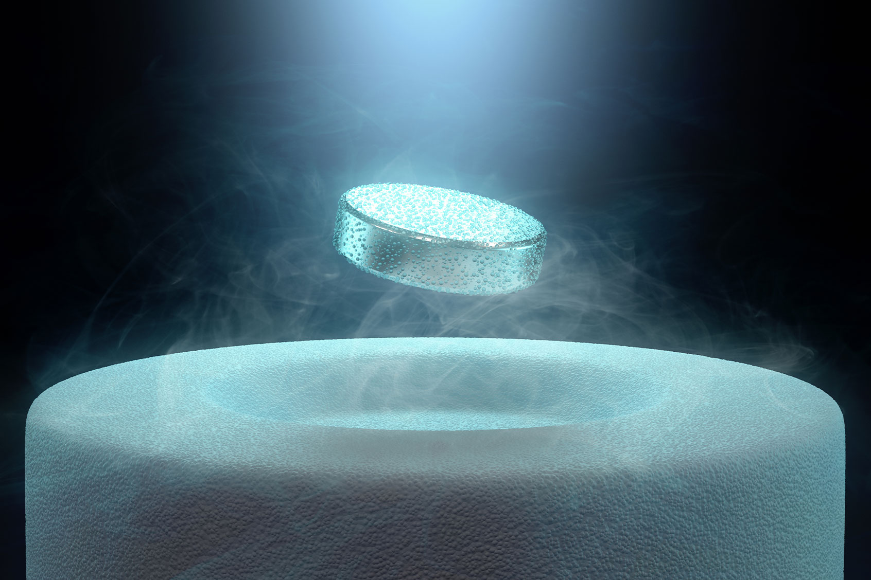 Image concept of magnetic levitating above a high-temperature superconductor, cooled with liquid nitrogen (Getty Images/ktsimage)