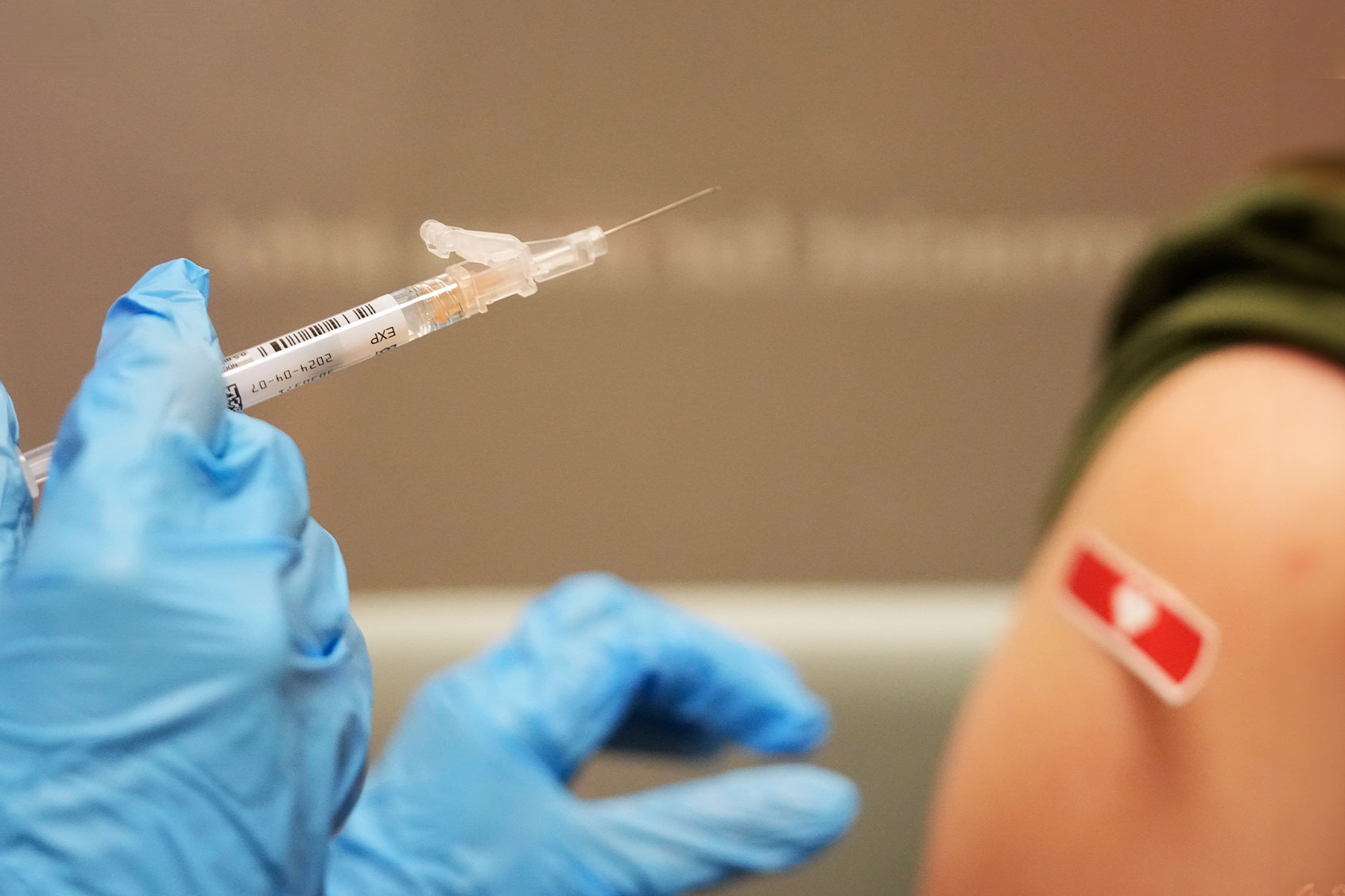 Kim Nguyen, pharmacist, prepares to give a Moderna Spikevax COVID-19 vaccine at CVS, 12550 Louetta Rd., Wednesday, Sept. 20, 2023, in Cypress, Texas. (Melissa Phillip/Houston Chronicle via Getty Images)