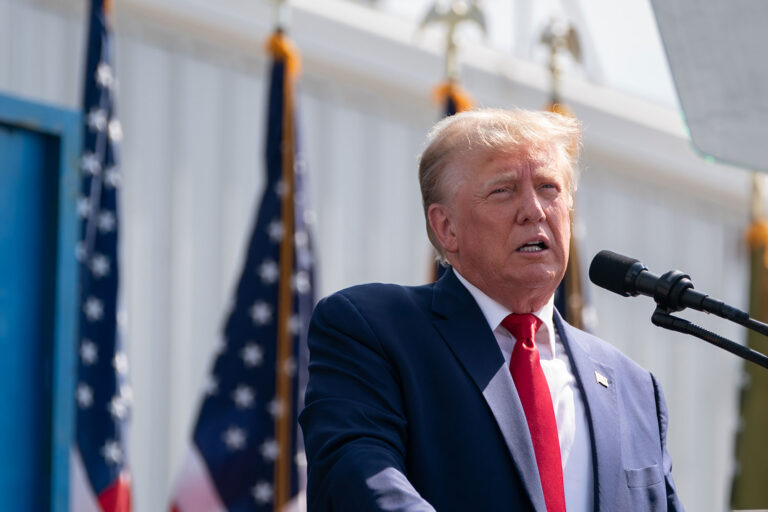 President Donald Trump speaks during a campaign rally as members of law enforcement watch the crowd on September 25, 2023 in Summerville, South Carolina. (Sean Rayford/Getty Images)