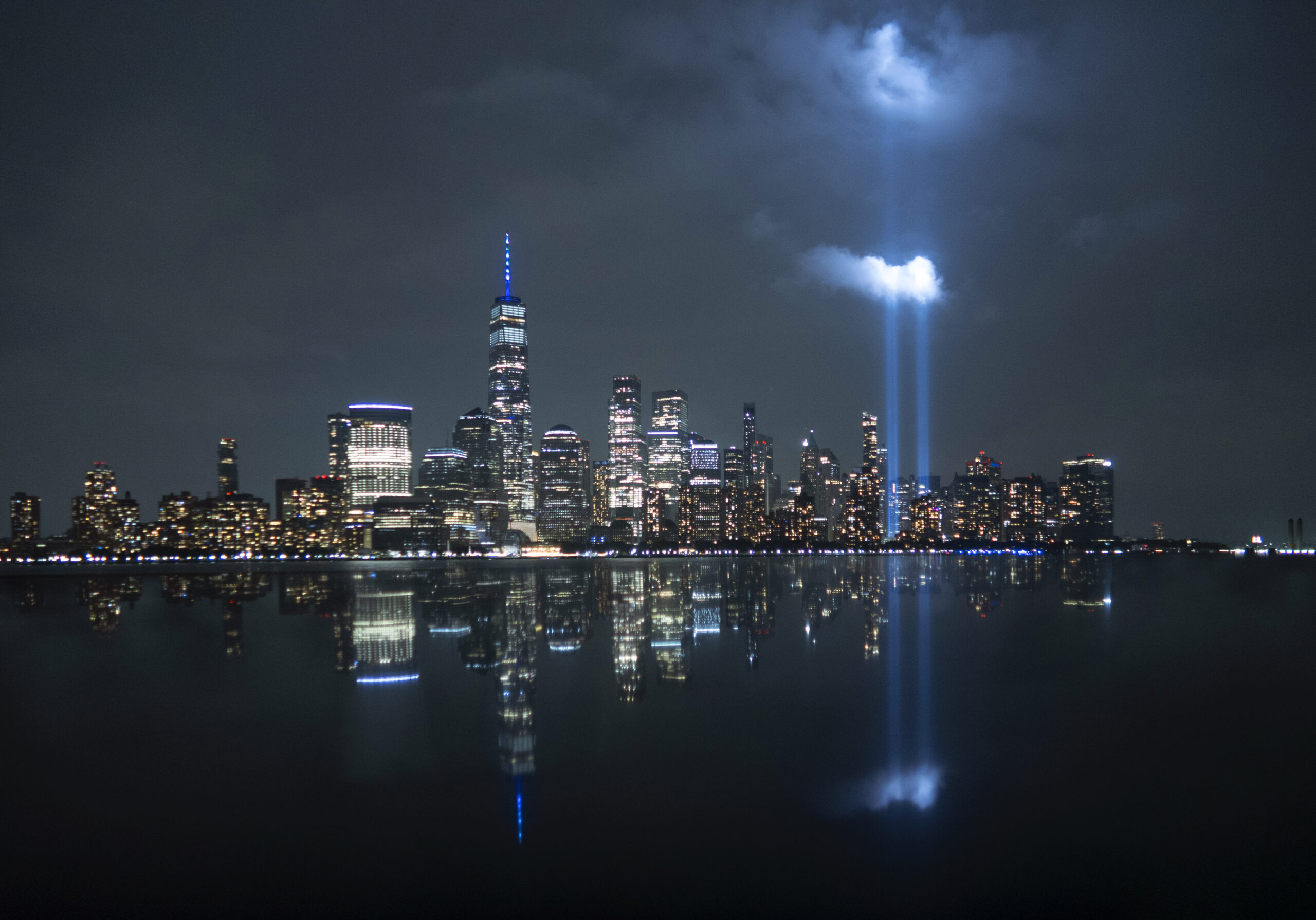 The annual Tribute in Light is illuminated above the skyline of lower Manhattan and One World Trade Center and the Statue of Liberty, Sept. 10, 2023. (Gary Hershorn/Getty Images)