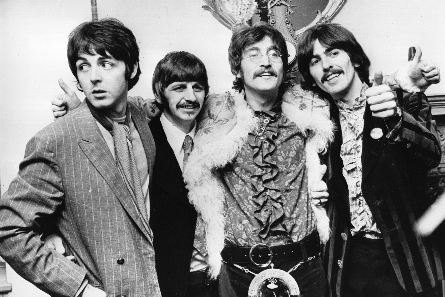 The Beatles celebrate the completion of their new album, 'Sgt Pepper's Lonely Hearts Club Band', at a press conference held at the west London home of their manager Brian Epstein. May 19, 1967. (John Pratt/Keystone/Getty Images)