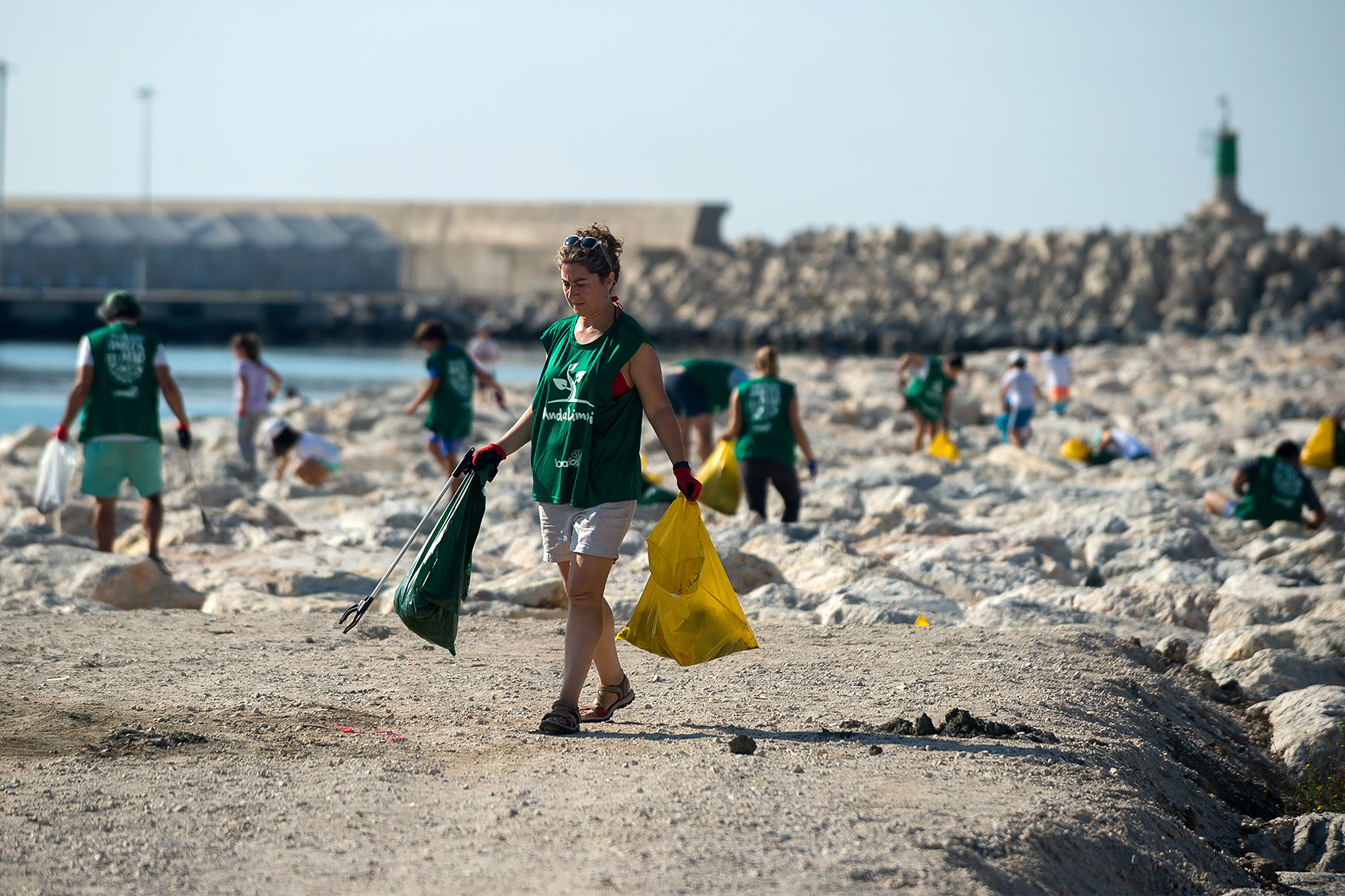 Volunteers are seen collecting waste and plastic during the cleaning of San Andrés Beach ahead of World Environment Day on June 5th. (Jesus Merida/SOPA Images/LightRocket via Getty Images)