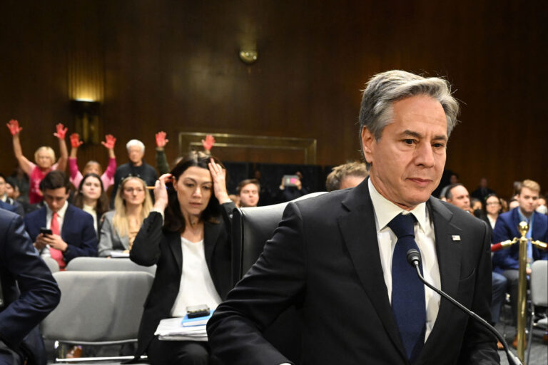 US Secretary of State Antony Blinken looks on as protestors hold their hands in the air during a Senate Appropriations Committee hearing to examine the national security supplemental request, on Capitol Hill in Washington, DC, on October 31, 2023. (SAUL LOEB/AFP via Getty Images)