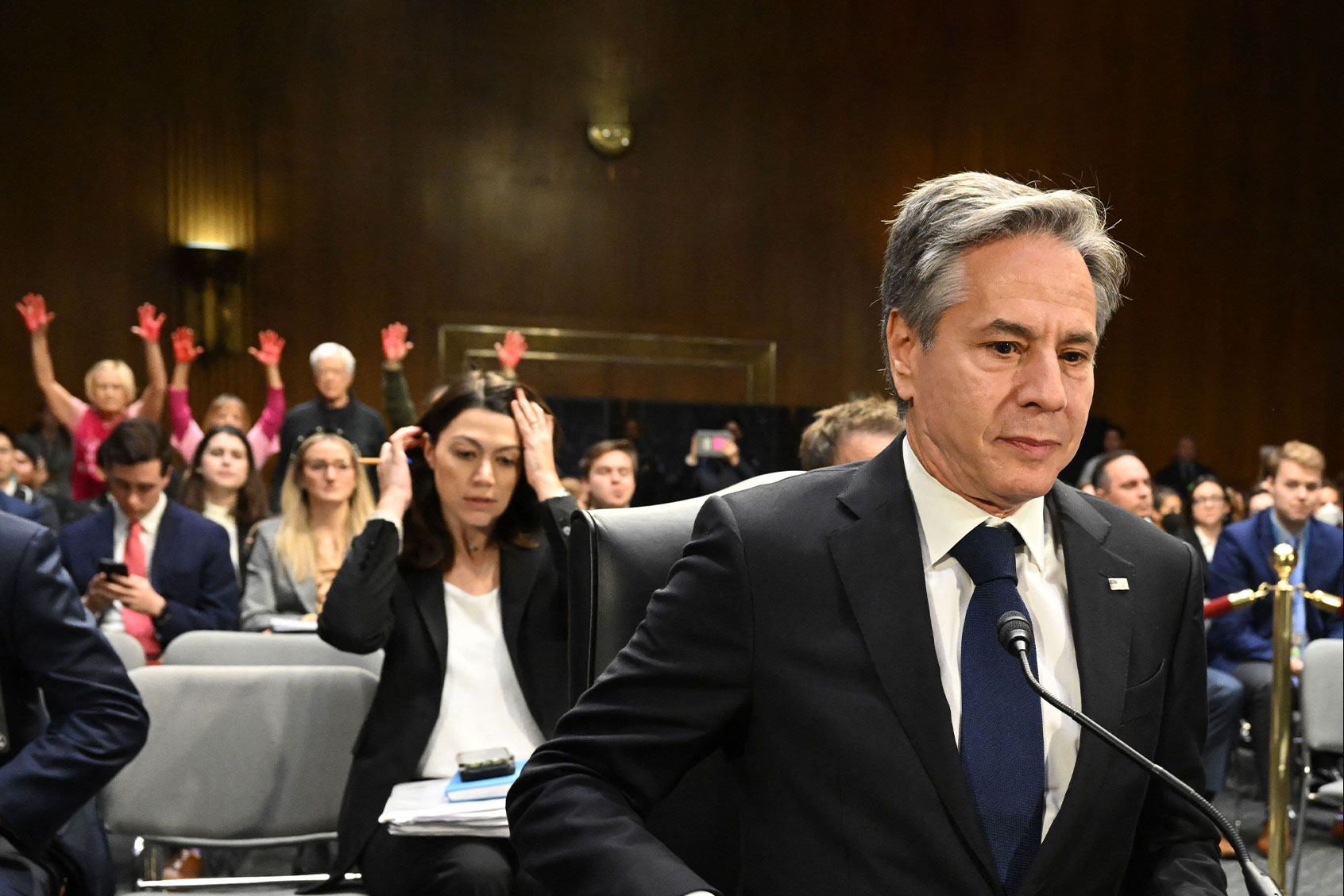 US Secretary of State Antony Blinken looks on as protestors hold their hands in the air during a Senate Appropriations Committee hearing to examine the national security supplemental request, on Capitol Hill in Washington, DC, on October 31, 2023. (SAUL LOEB/AFP via Getty Images)