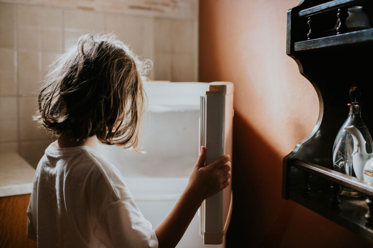 A child looks into an empty fridge (Getty Images/Catherine Falls Commercial)