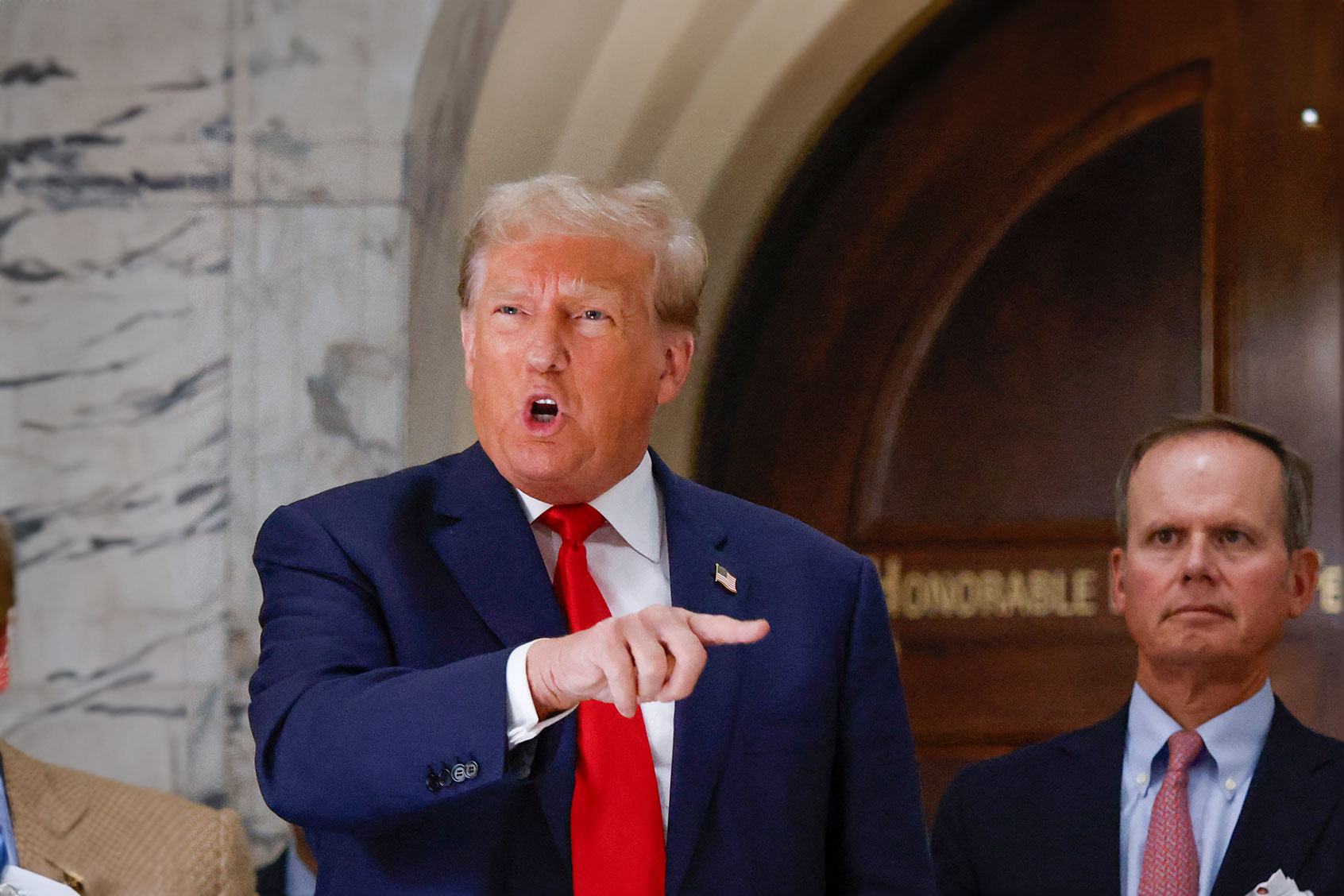 Former US President Donald Trump speaks to members of the media during the third day of his civil fraud trial in New York on October 4, 2023. (KENA BETANCUR/AFP via Getty Images)
