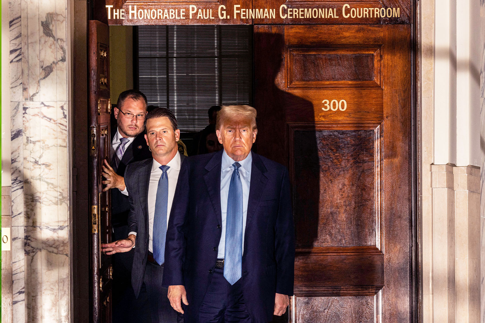 Former US President Donald Trump retuirns to the courtroom after a break during his civil fraud trial in New York on October 18, 2023. (ALEX KENT/AFP via Getty Images)