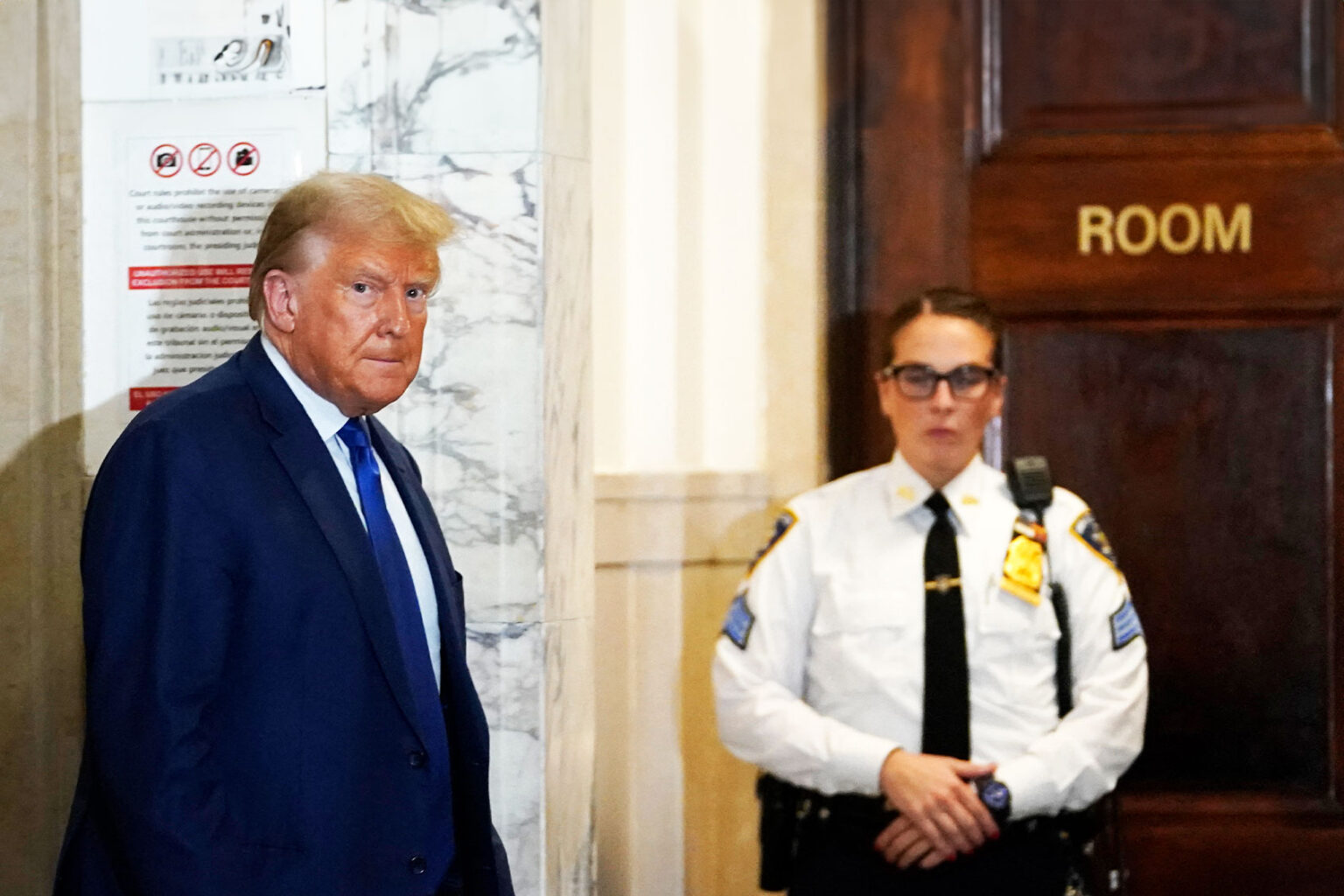 Trump storms out of court chased by Secret Service after being slapped ...