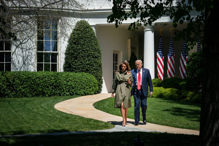 U.S. President Donald Trump and first lady Melania Trump exit the Oval Office as they arrive to participate in a tree planting ceremony in recognition of Earth Day and Arbor Day on the South Lawn of the White House on April 22, 2020 in Washington, DC. (Drew Angerer/Getty Images)