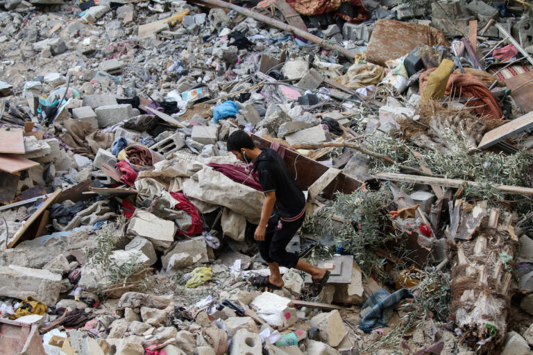 Palestinian citizens inspect damage to their homes caused by Israeli airstrikes on October 08, 2023, in Gaza City, Gaza. After the October 7 attack launched by Hamas on Israel, which surprised them, Israeli Prime Minister Benjamin Netanyahu asked the Palestinians to leave Gaza, and warned that the army would turn Hamas positions "into rubble." (Ahmad Hasaballah/Getty Images)