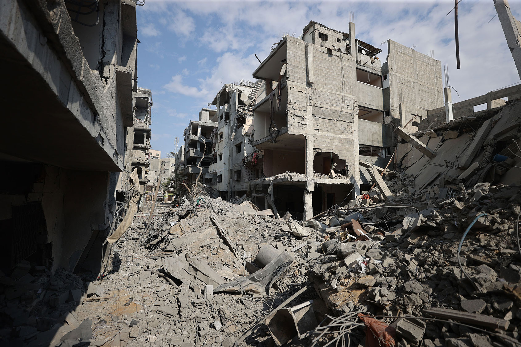 Palestinians look for their belongings among the rubble of their destroyed houses as Israeli attacks continue on the 10th day in Gaza City, Gaza on October 16, 2023. (Mustafa Hassona/Anadolu via Getty Images)