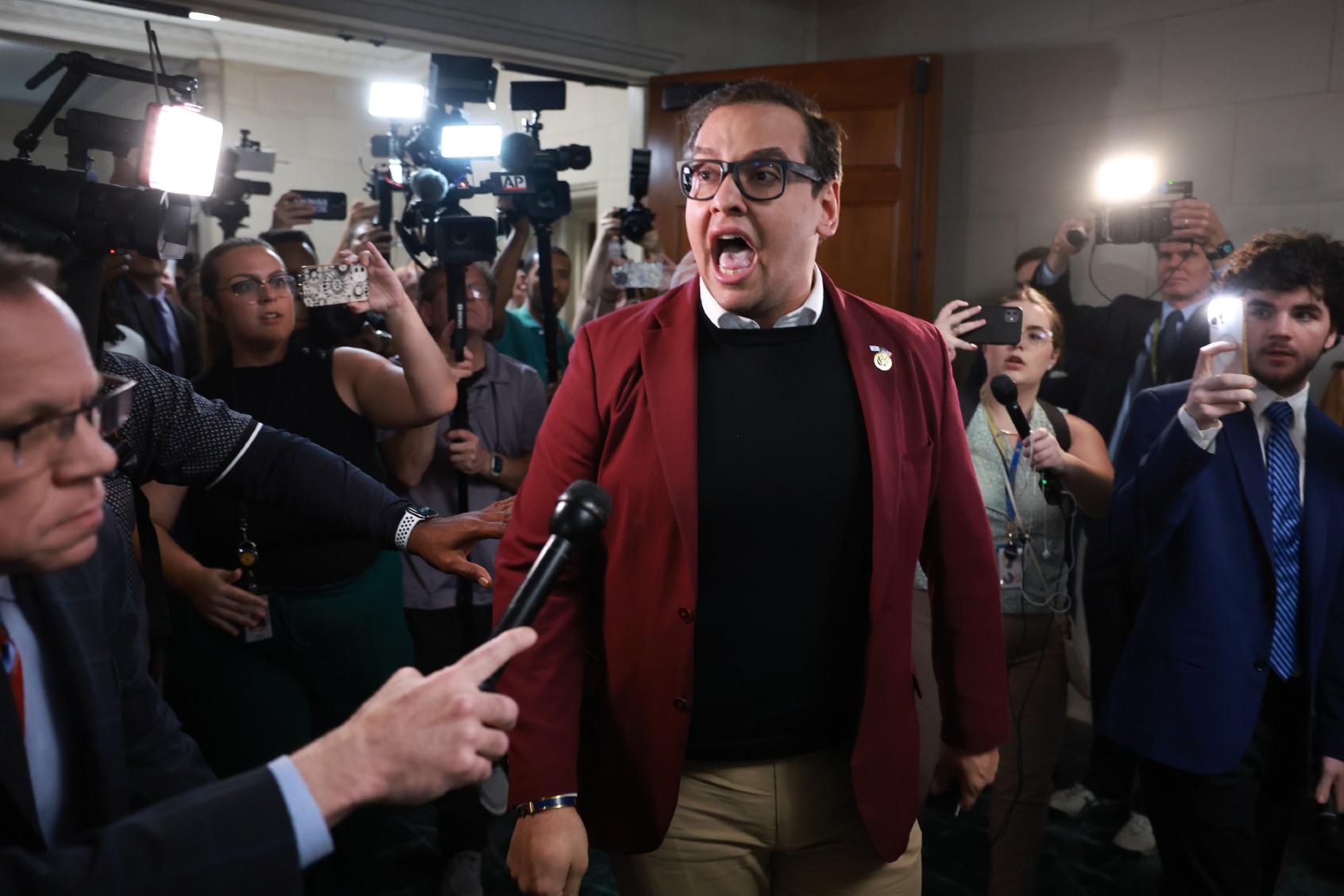 U.S. Rep. George Santos (R-NY) becomes emotional as he talks about the situation in Israel during a break in a House Republican caucus meeting at the Longworth House Office Building on October 13, 2023 in Washington, DC. (Joe Raedle/Getty Images)