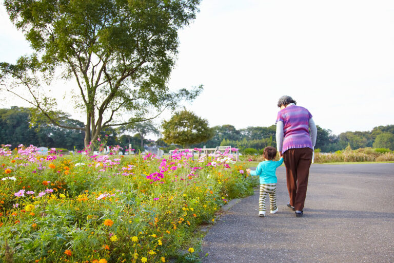 Grandmother and grandchild walking hand in hand (Getty Images/Doable)