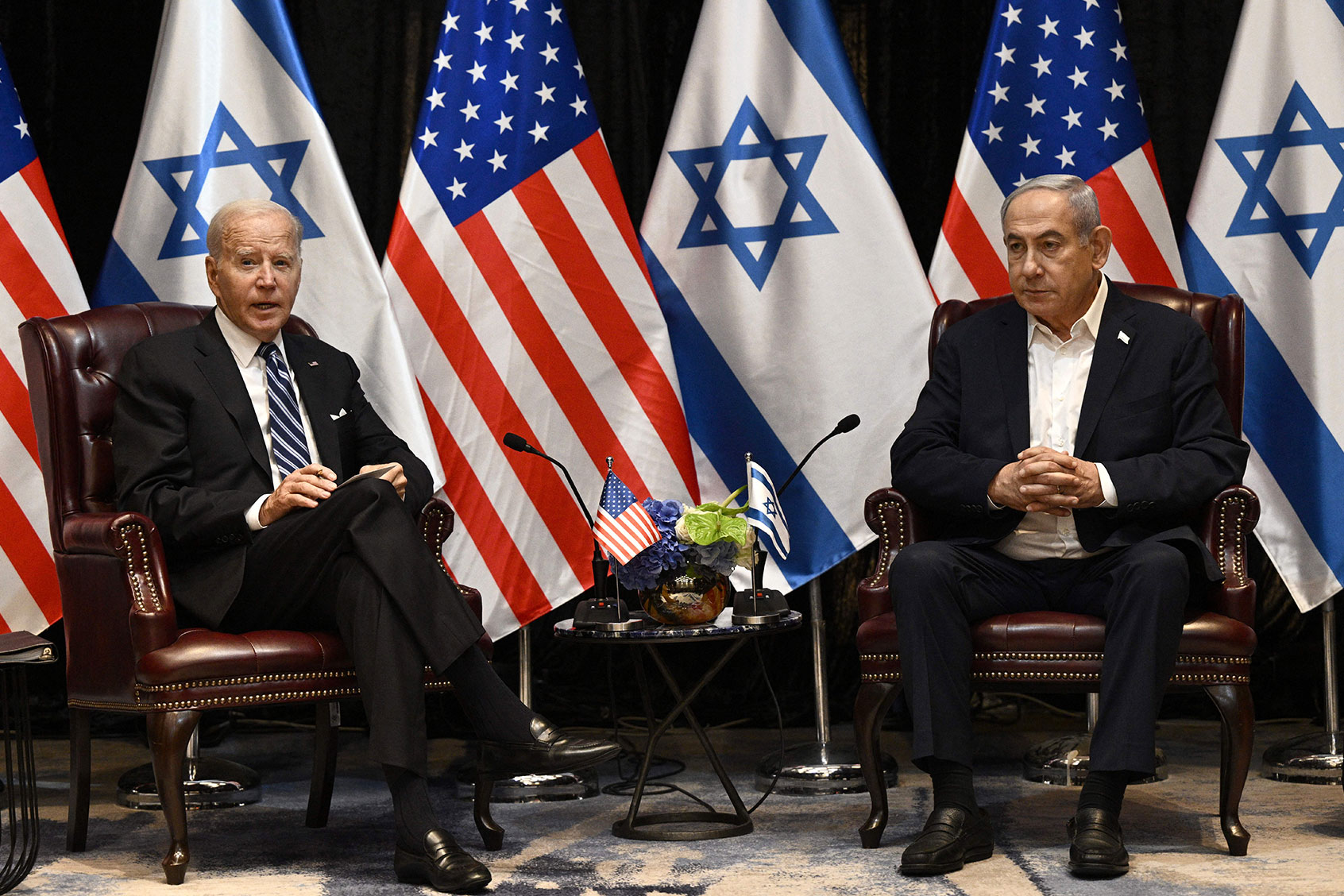 US President Joe Biden (L) listens to Israel's Prime Minister Benjamin Netanyahu as he joins a meeting of the Israeli war cabinet in Tel Aviv on October 18, 2023, amid the ongoing battles between Israel and the Palestinian group Hamas. (BRENDAN SMIALOWSKI/AFP via Getty Images)