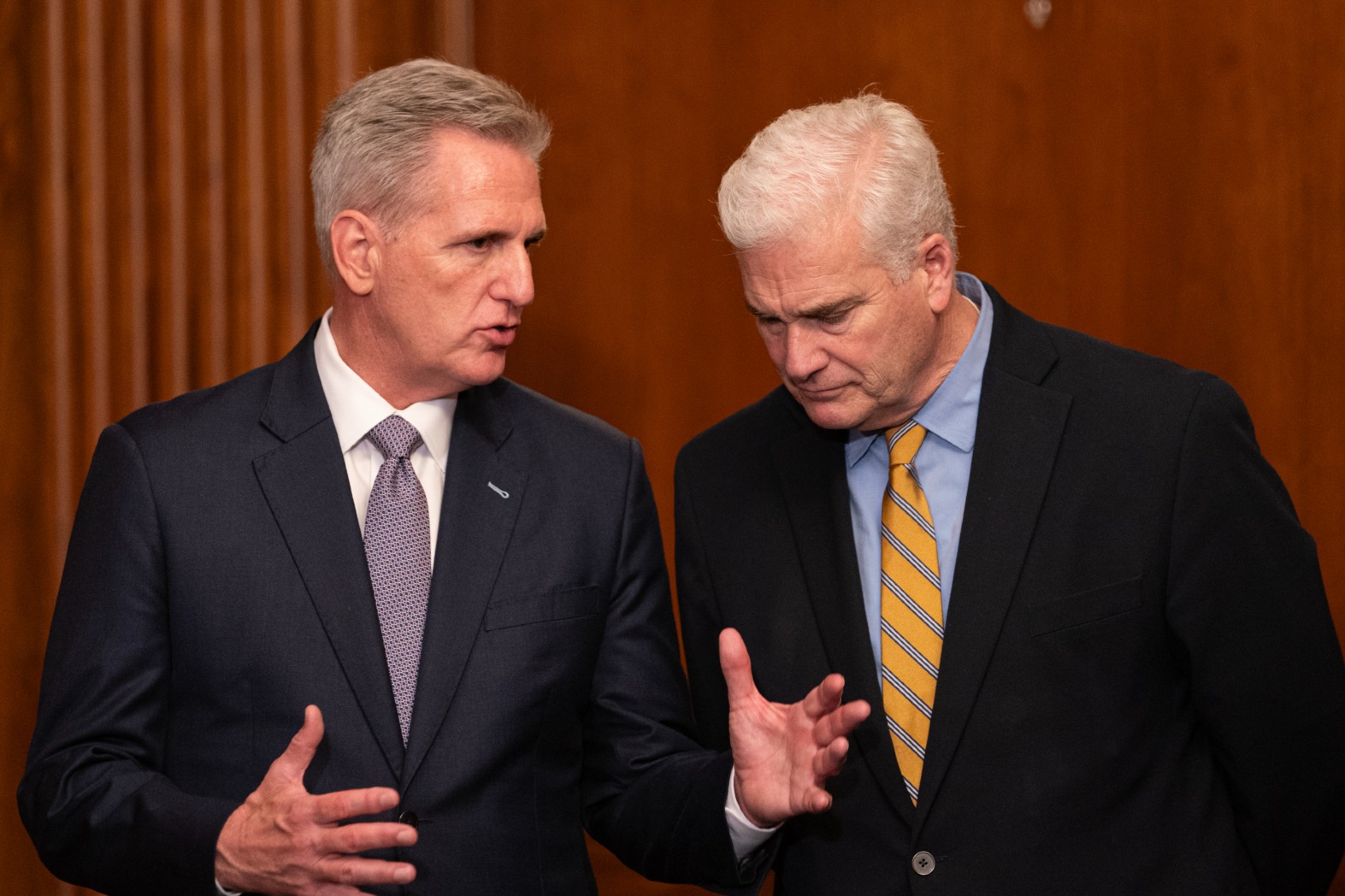 Kevin McCarthy (L) (R-CA) speaks with Majority Whip Rep. Tom Emmer (R-MN) following passage in the House of a 45-day continuing resolution on September 30, 2023 in Washington, DC. (Nathan Howard/Getty Images)