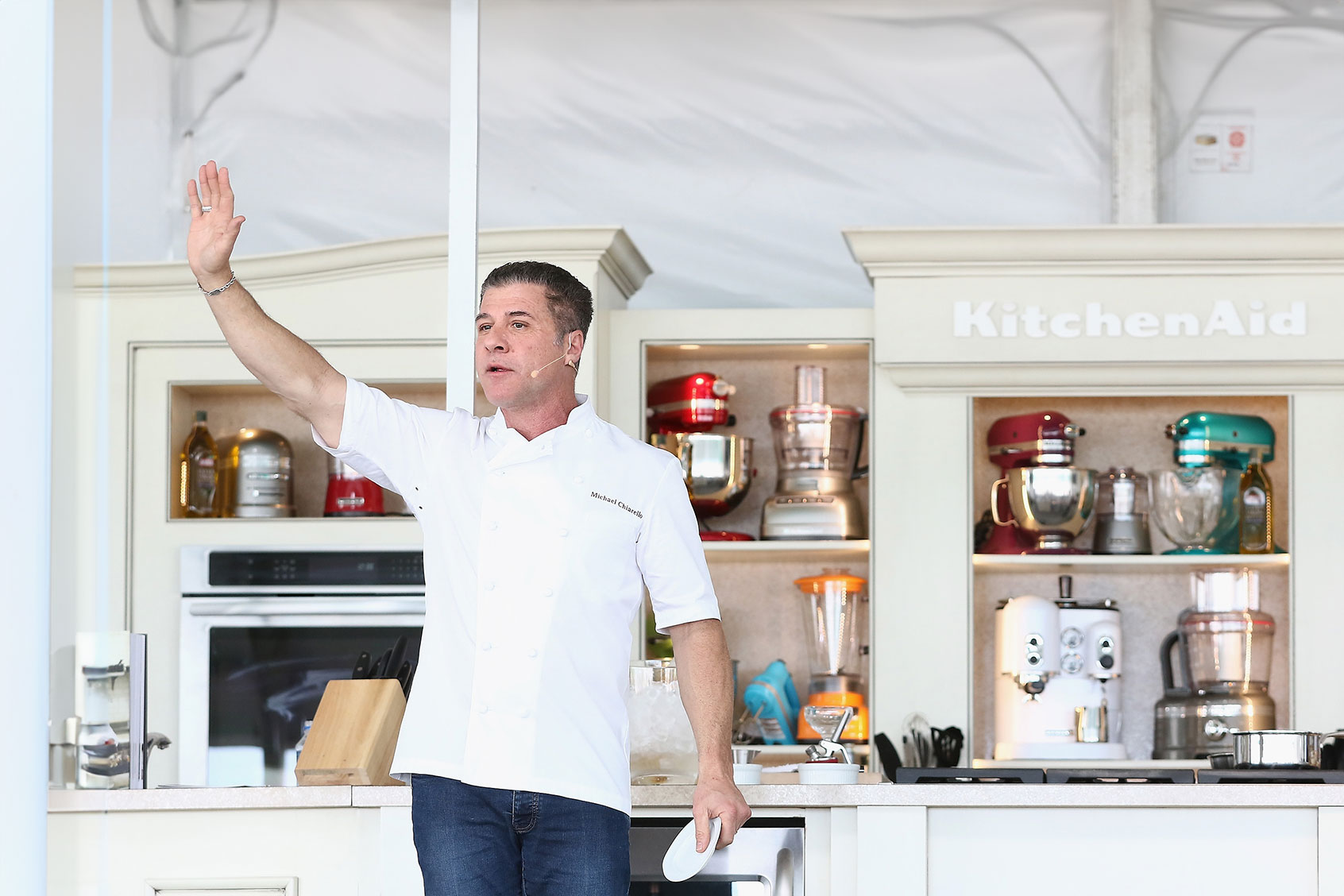 Chef Michael Chiarello presents at the Whole Foods Market Grand Tasting Village Featuring MasterCard Grand Tasting Tents & KitchenAid® Culinary Demonstrations during the 2015 Food Network & Cooking Channel South Beach Wine & Food Festival at Grand Tasting Village on February 21, 2015 in Miami Beach, Florida. (Alexander Tamargo/Getty Images for SOBEWFF)