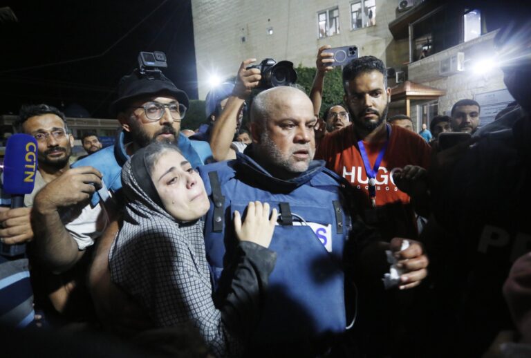 Al Jazeera reporter Wael al-Dahdouh (C) carries his injured son from ambulance to hospital in Gaza City, Gaza on October 25, 2023. (Ashraf Amra/Anadolu via Getty Images)