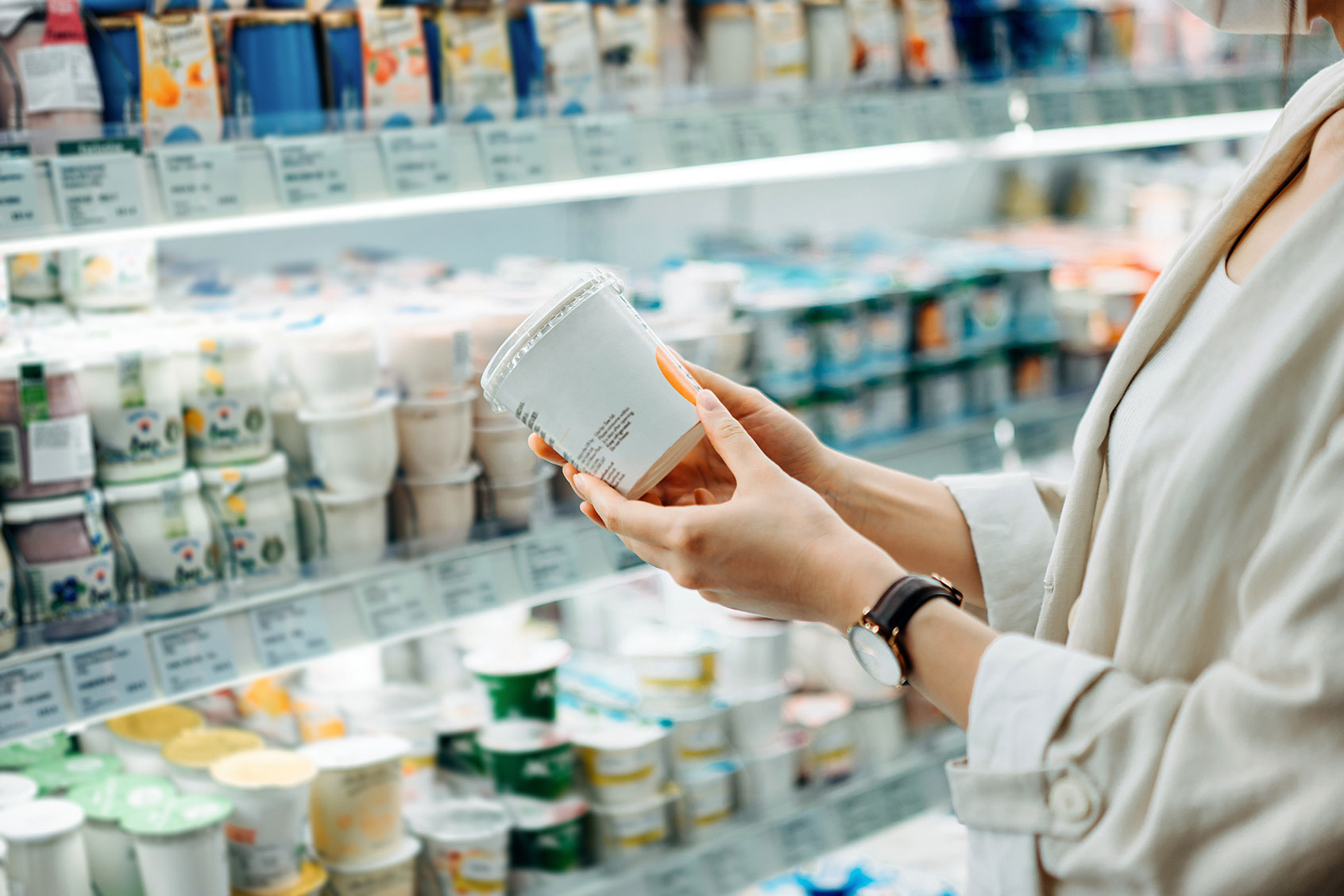 A woman shopping in the dairy section of a supermarket (Getty Images/d3sign)