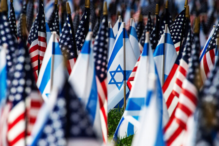 US and Israeli flags fill the field at Statler Park in Boston, Massachusetts, on October 18, 2023. (JOSEPH PREZIOSO/AFP via Getty Images)