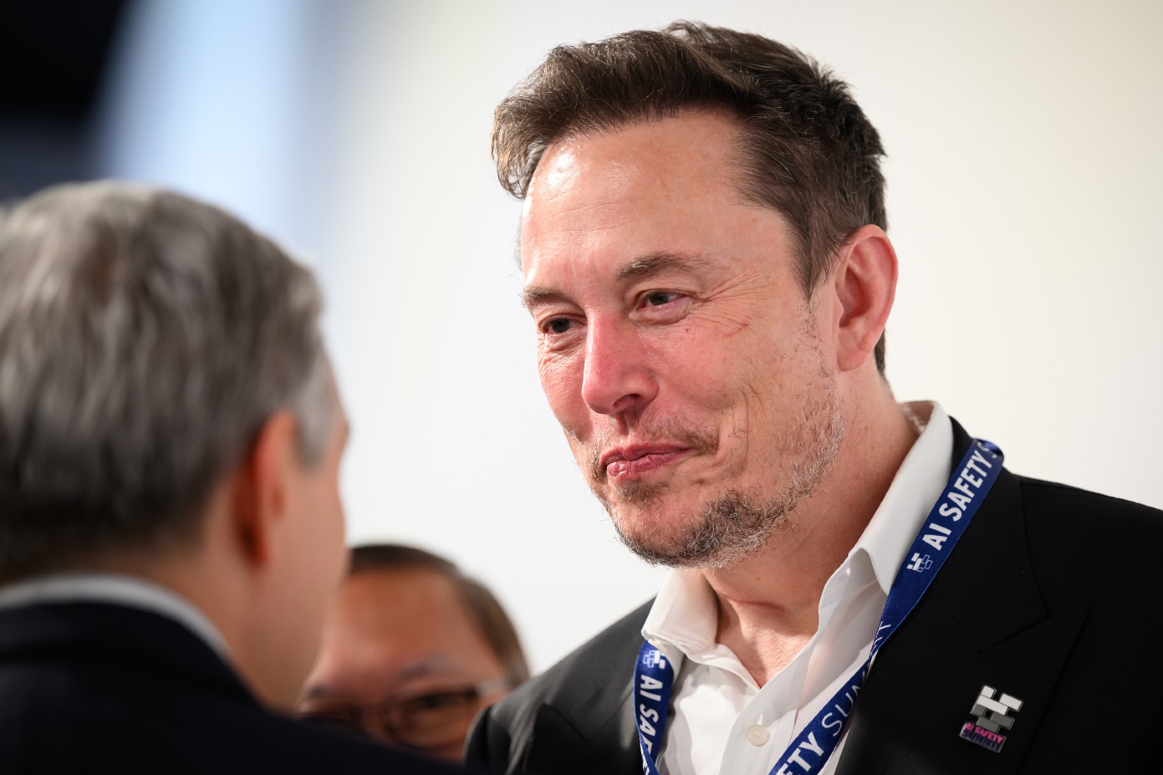 SpaceX, X (formerly known as Twitter), and Tesla CEO Elon Musk speaks with other delegates during day one of the AI Safety Summit at Bletchley Park on November 01, 2023 in Bletchley, England. (Leon Neal/Getty Images)