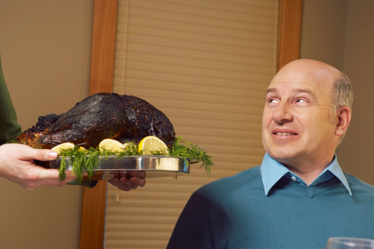 Man being served burnt turkey (Getty Images/Beau Lark/Corbis/VCG)