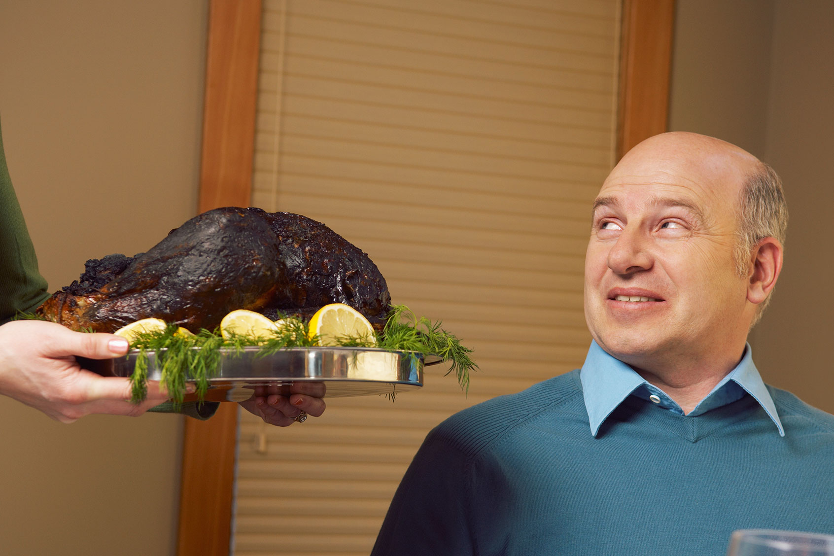 Man being served burnt turkey (Getty Images/Beau Lark/Corbis/VCG)