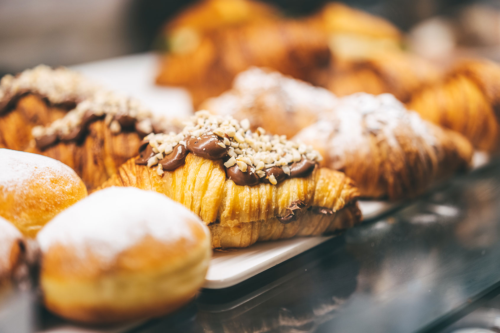 Homemade flaky pastry dough croissants, moist donuts, and buns with various flavored fillings. (Getty Images/Yana Iskayeva)