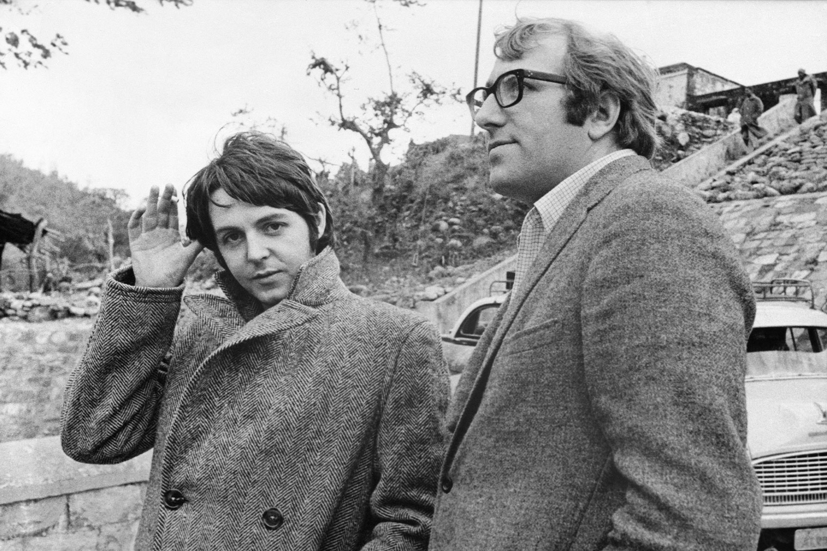Beatle Paul McCartney with his manager Mal Evans, shown on his arrival February 20th to join the other Beatles at Maharishi Mahesh Yogi's transcendental meditation center. (Getty Images)