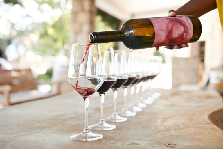 Pouring red wine in glasses (Courtesy of Plimoth Patuxet Museums)
