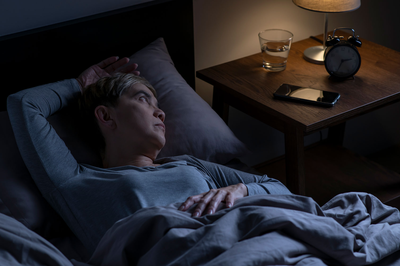 Depressed senior woman lying in bed cannot sleep from insomnia (Getty Images/Filmstax)